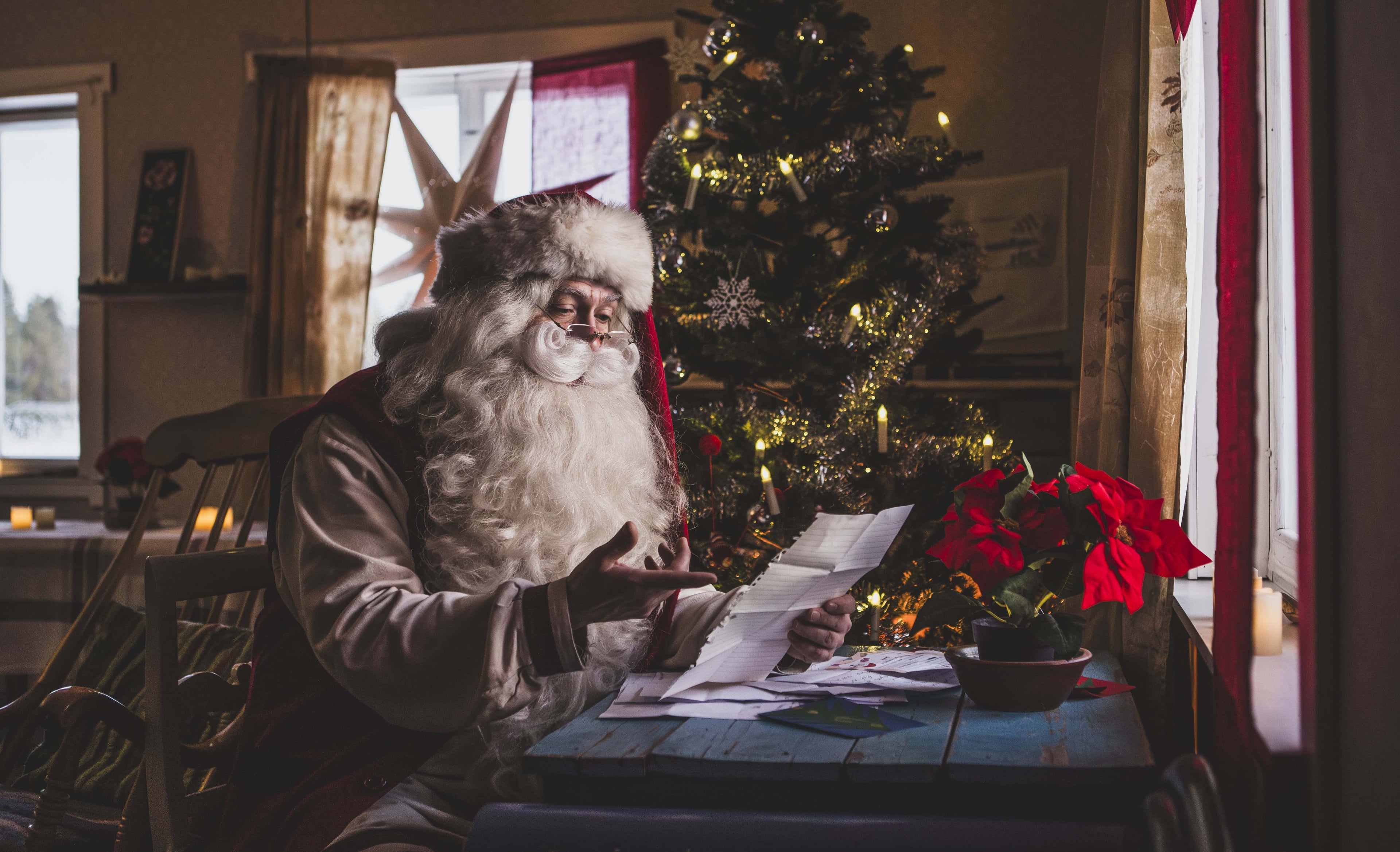 Moment with Santa - Santa Claus reading a letter